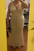This dress is stunning. The fabric looked like high quality. It runs a little short for me. It it very form fitting, and does not look good on me unfortunately. Uploaded a picture in case someone has my body shape. - Marte V.