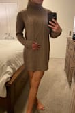 I ordered a size down, XS, based on reviews, glad I did. I'm surprised how soft and nice the material is. It fits great, not too long it too short, see photos to see where the hem stops, I'm just barley under 5ft 7in. Will be sooo cute with tall boots or even ankle booties. Don't wear any bright colored or sparkly undergarments, as there's a little space between the knit stitching. I was wearing panties with thick rhinestone waist and could see a tiny bit of sparkle showing through. All in all I love it!!! But definitely order a size down. - Hannah A.