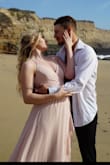 I absolutely love this dress! I used it for my engagement photos and it was perfect! Tightens in the back too to adjust to anyone's size. Very true to size. It was a tad long but it didn't bother me at all. Super flowy! I loved it! Random fact may or meat not be useful but I was worried when I laid in the sand at the beach I'd ruin it or it was get all wet and sandy but it didn't get dirty or leave marks or sand on it. The material is actual magic! - Kat P.