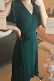 I absolutely love this dress, always have wanted an emerald green dress!

Thoughts: the color is definitely emerald green(dark teal green color) but it looks a lot darker in artificial light, but in the sunlight it's brighter. The quality is spot on, not see through at all, and very soft fabric. I'm thankful for once for small breasts because I was able to sew the deep v-neck to be less showy, but if I had a bigger chest I wouldn't have been able to make the waist as tight as I wanted or close the top. If you have a bigger chest than me, definitely go up a size if you want to sew the neckline a little. - Svea H.