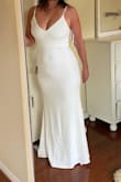 While I didn't pick it as my wedding dress, it was my second choice. It's super sexy and classy. I'm tall with a smaller waist and larger bottom, and felt it really complimented my body type. Very comfy and stretchy, and a little big to be honest. My only issue was it wasn't glam/wedding enough. My mom tried it on too (second pic- she's a size or two larger than me) and she looked fantastic. So consider sizing down! - Nicole B.