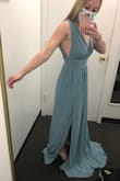 I really liked the look of the dress online, but it definitely runs a size larger than your normal size. I am typically a S, but the S was way too large. Unfortunately, I had to stick with the size because the XS wouldn't be in stock for another month and a half and I needed this dress by the end of the month to stand in a wedding. I had to get the dress massively tailored (which cost more than the dress sadly). I also thought the dress was a few shades darker in person than online. - Lizzy R.