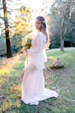 This dress was absolutely phenomenal. I ordered it two weeks before our elopement and it fit PERFECTLY. It's super boho and very flattering on a thinner build. Really great quality for the price too. The first dress I ordered had a sewing issue in the boob, but they shipped a new one immediately. - Keely S.