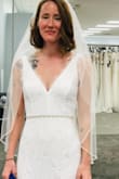 Absolutely love it. Very easily paired with sash/belt and veil. The dress runs long and I need to wear very high heels or hem it to avoid tripping forward on it. It's beautiful white lace, the material is comfortable and soft, and it's easy to move around in. I just wish there was a button on the dress to hook up the train or elevate it a bit for the reception when dancing and walking around to avoid getting the bottom of the dress dirty or tripped over. Perfect fit- very true to size. I'm about 5'5 and half between 5'6 and pear shaped. It's flattering for my body type. Thank you Lulus for making this so lovely! Very happy with it! - Jackie M.