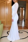 As soon as we received an available date for our pandemic wedding, here in Spain this past December, I went straight to the Lulus website to start browsing. I am so thankful the dress arrived here on time. Even with expedited shipping, I was cutting it close. When the dress arrived and I tried it on, I was amazed how perfectly it fit me; like a glove. I felt beautiful and elegant. I loved the deep V-neck style and back. I did not have to alter the dress at all. It looked a little long but honestly, I think it looks much better that way. I ended up wearing low heels with the dress and it was perfect. I received many compliments on the dress and everyone thought it was super expensive. The dress was surprisingly much better quality than I was expecting. The lace was thick and there were no flaws. The bottom part of the dress has two layers of lining underneath, which allows the dress to stay put and not ride up. Thank you Lulus for making my wedding dress shopping so easy and affordable! - Thinh N.