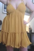 I love the color of this dress. Perfect for a summer day or night. My only issue is that the back folds over a bit, but that's typical for halters when you have DDs I suppose. Arrived as described. Decent quality. Much love for this sunny sexy dress. - Ellen W.