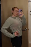 This is such a cute and cozy sweater! I purchased in a medium and got the slouchy look that I was going for - if you want it to come in tighter towards the bottom I would suggest going a size smaller. I love that it is a lightweight sweater that doesn't cause me to get too warm, it's easy to layer with if need be. The light grey is such a great color and I've had fun dressing this top up for a night out or for a cozy day at home. Pretty much my go to on the weekends. <3 - Laura B.