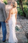This was my dream dress! This was so so soft and comfortable! I did have to get it hemmed a few inches and it was a bit snug but they were out of a small and it still looked great! Everyone loved the dress and were shocked when I told them the price! The only negative was that The bottom of the dress would catch on a lot of nature since we were outside the whole time, but it didn't bother me all that much because this dress was so affordable and my photographer was able to brighten the bottom up in our photos. Other than that it was so perfect! - Theresa W.
