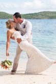 This dress was so beautiful, so comfortable and perfect for my beach wedding! Bust/rib area is small and is my only complaint. I had to have it altered and have zipper removed and added corset strings. I was pulling dress up
all day, but it was a small price to pay for a dress that fit like a glove. - MONICA C.
