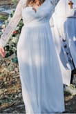 Like many other 2020 couples, my husband and I opted to postpone our big celebration and get married with just our immediate family present this past fall. We had a riverbank ceremony just before sunset, and this dress was perfect! I just had it hemmed and likely could've afforded to have it taken up in the shoulders/arms but didn't due to time constraints. I was very comfortable and have gotten so many compliments from people who have seen pictures. This is a good quality dress for a great price! Will definitely try to recycle it for another purpose for our larger celebrations! - Ashley A.