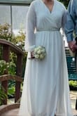 I have a smaller waist so I think the medium would have fit but I have heavy upper arms so I went with the large. It was perfect. I added the belt and received compliments on it from many people. Even though it was below zero out, it worked for a winter wedding. Thank you for making me feel beautiful on my day! - Julie S.