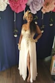 The dress is exactly as pictured. It was able to fit around my baby bump, 6.5 months pregnant. It was comfortable around my midsection & held the twins up, no bra needed. - Cassandra O.