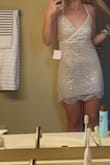 This dress is so beautiful in person! I love the different colors and with the flash on, it's very bright and silver/white. I was right in between XS and S. Started with S but I'm short and it looks too baggy on me. XS fits perfect but a little snug to zip up. - Tori A.