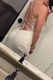 I had originally had a $1400 wedding dress that I had worn for our ceremony. Due to COVID we postponed the reception. I thought maybe I'd look at getting a different dress but I didn't want to spend a lot. For the price, it looks absolutely gorgeous. It is not as thick as my $1400 wedding dress, but I'm glad it isn't since our reception is now in August. They unfortunately don't carry a size 0 which I usually am, so I ordered a 2 it was slightly big, which is to be expected so I would say it is definitely true to size. There is a ton of glitter on this dress and the top and back is absolutely gorgeous. - Alexis S.