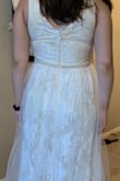 I love the dress! I wanted something simple for my more casual wedding and this fit the bill. I'm a little short at 5ft 4, so I'll have to get the straps taken up a little bit and lose some length at the bottom. But other than that it fits great! And you can wear a regular bra with it which is a requirement for any dress I buy. - Ann K.