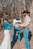 The dress looks beautiful on camera! I had an elopement ceremony but I still wanted to get pictures done and I love how the dress looked in all of the pictures. I paired the dress with a denim jacket. I got a size small and the fit and length was great for me. I'm 5'6," wear a 34B, and typically go for a size 4 or size 28 for pants. I have a rounder bum so I was worried about not having enough stretch, but this dress does have some stretch even though the description says otherwise! - Emily C.