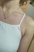 This used to be my absolute favorite tank top! (The version I bought a couple months ago still is) I wear it constantly as you can tell from how it's no longer white lol. The new one is different in every way. I wish I could add more photos because it's actually laughable that these are both the xs/s. Lined up side to side the new one is over an inch smaller than my first one. I also wash my clothes on cold and air dry everything so there is literally no way laundry could have caused my original one to somehow stretch out. Im super sad cause people actually make fun of how much I wear this tank although the large is too big. Oh well! - Grace K.