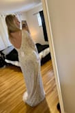 This dress is beautiful! Such nice quality and doesn't feel super heavy while on. I ordered a small and it was perfect for me. The train on the back makes it so elegant! I love it and am going to wear to my rehearsal dinner :) - Stephanie C.