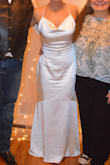 This dress was perfect!! I ordered a Small and it fit a tad loose, but this meant I was able to move freely and comfortably throughout my entire wedding. I had it altered to decrease the length and to bring it in tighter between my chest and armpits, which were very slight alterations. This dress is simple, elegant and I'm very thankful I found it! - Miranda W.