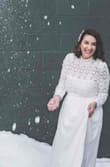 I got this dress for my last minute elopement and it was everything!! It is flattering for all waists and hips sizes. I had it hemmed for length and the arms shortened. 100000% would recommend sizing up if you have large breasts like me as the top doesn't have any stretch. I had a problem finding a bra with this dress because the back is see through and the top is very low cut. So I just used boob tape. - Sydney L.