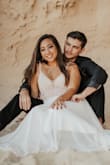 Very beautiful dress with great beads detail it was the perfect dress for my wedding. Only this I didn't like was how long it was but very easily hemmed. - Lilia Y.