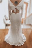 When I saw this dress online for the first time, I immediately fell in love. My family kept telling me not to order it, I shouldn't order my wedding dress online, and so on. However, I am so glad that I didn't listen to them. This dress fits near perfect on me! I am planning on having a few alterations done to make it completely seamless, but even if you decided not to, the dress is very very true to size. I am also planning on adding a pearl belt to the dress to cover up the seam, but the seam is not noticeable and it is a completely optional add-in. Also, shipping and handling was so quick, which is hard to do during the pandemic, so I was very pleased with customer service as well! I'm still so over the moon about how beautiful my wedding dress is and so are my relatives. If you are looking for a boho look for your winter wedding that won't break the bank, then look no further! - Kristen S.
