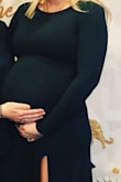This dress is heavier than expected which makes it perfect for cooler weather. It does not feel heavy on. The material is very soft. I ordered a small and actually ended up wearing it to a wedding and then again a year later during my baby shower at 35 weeks pregnant. - Kelsey H.