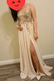 So this dress color was way different than what I expected.  I was thinking the dress will be a cream colored but it was more of a champagne color with a hint of beige. Personally, I was not a fan of the jeweled top; kinda seemed too costumey for me. The fit was really great though since the back had a lace up. - HaRi K.