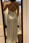 Nice material and a beautiful dress. It's silky smooth on the skin and not very thick so petals and super seamless underwear are a must. This would be a nice dress for a beach wedding! - Cristina M.