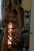 OK so, I actually bought this dress in two colors because I was unsure which one I would like more, white and this rose gold (both size S). The rose gold one fit perfectly, and I'm in love with the color so much and will be keeping it. The white was also a nice color, nice material too, but IT WAS SO MUCH BIGGER. I have no clue why since they're both size S, but if you're confused with sizes, I recommend ordering two sizes as well because the white one would've fit me as an XS I believe. The photo attached below are the dresses layered on top of one another so y'all can see the difference in sizing, again both size Small. - Fallon F.