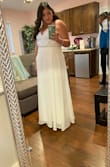 This dress is absolutely beautiful!!!!! And for the price you can't beat it!! I was afraid it would be too small for me. They didn't have a 1X when I ordered so I got an XL and it fit just right. I did get it altered from them length though because it was a bit long for my liking. I did add a bridal belt to it as well for that extra touch. But overall it was just what I wanted for my wedding. Very happy with this dress. - Adriana S.