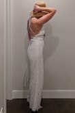 I really wanted to love this, I loved the overall lace and strappy back. I ordered a M hoping to accommodate athletic legs that tend to go up a size in rompers/onesies. I would need to order down a size and see; the M fit my legs and butt, but even with the lacing back there was a gap at the clasp. I ultimately did not order a new size however because bathroom logistics and said laced back. I would need a decently tall pair of heels to keep the legs from dragging (fine by me, but added for length consideration). Thinking of a beachy pairing with the Ivory Straw Bucket Hat - Andie F.