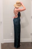 First time buying a Lulus jumpsuit and had to guess on size. I fit in S dresses, but with athletic legs I love my M Lulus romper. For this one I would consider down a size. There was a lot of extra fabric around the middle and legs (more than what the style looks like per the model). I loved the back and plunge neckline. I also loved the satin feel and drape, but would be worried about snagging it. I also would have to hem it, unless the S is also shorter in length. My tallest pair of heels and the legs were still dragging. Tried on with the Ivory Straw Bucket Hat. - Andie F.