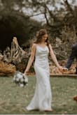 Truly such a simple classic look, I was in LOVE! I was iffy about the front being shorter than the back, but I used it as an opportunity to wear a colorful shoe (blue suede shoes also from Lulus). This dress is so soft, so light weight, so beautiful. I used it as my wedding dress and don't regret a thing. The button detail on the back was my favorite part aside from the cowl neck! - Bailey B.