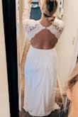 This is a beautiful dress, the seller is the open back. The front is alright, a little grandma-ish. I bought this originally for my wedding dress then returned for something that made me feel sexier and more like a bride. One of the greatest parts was that the sleeves fit! I always have problems with that and the Large fit me perfectly. It also does run a bit long, if I wore this dress I would have had to get it hemmed. I have a smaller waist and big ol hips and this fit me perfectly, a tiny bit tight in the waist but not terrible. In order to be more comfortable I ordered an XL in the other dress I ordered off Lulus. I normally wear size L in tops and size 12 in bottoms. - Ashley D.