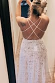 This dress instantly made me feel like a bride and sexy. I had tried on 3 other dresses, 2 from Lulus and one from Amazon. This one was 100% the winner from everyone who saw it. I originally bought a L, then returned for the XL, since the the back on the L was a little tight and my booty was too big for me to snap the onesie. I would recommend if you have a booty to size up. It's better to be covered and comfortable that too tight! The photos attached are from the L. Also. Shoutout to customer service, who expedited my exchange in sizes so gracefully and quickly!, to get here before we left to elope in Maui. That's enough to make me want to keep shopping with Lulus! I'll update when we get our elopement photos back! - Ashley D.