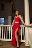 This is a stunning jumpsuit. Truly. I wore it for my stay-at-home birthday celebration and felt so sexy and confident. Can't wait to wear it outside of my house!! The pants look more like a skirt when you actually put them on, but that doesn't take away from how gorgeous this piece is.
Now, the fit. I have a big booty, so whenever I buy pants/jeans, I go for size M. That was my original plan for this jumpsuit, but after reading the reviews, I realized the pants already run very long, so I sized down and bought the jumpsuit in S. The pants fit (although getting them past my booty proved to be difficult) but, as expected, they were too long (even with heels), so I had to get them hemmed. The hemming cost me $40, which is half the price of this jumpsuit, for reference. After that, they fit nicely, but still, I'd only wear them with heels. I am quite small-chested, so the top fit, and it definitely helped that it was adjustable. 
Sharing all of this to help someone with a similar body shape to make a decision! - Elina K.