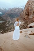 This dress is just insanely beautiful. The details on the top are beautiful, the quality of the crochet is great. It's not heavy, and it is very flowy. My favorite part was the open back, with the scallop details. Such a beautiful dress. - Justine B.