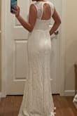 This dress looked like it did in the pictures. Felt like high quality, fit well and would need only the smallest alterations because my torso is somewhat short. Overall it's a beautiful, simple classy dress. - Hannah C.