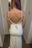 This dress is so flattering! As I told my husband, "This is the best I have ever looked!" Lol! :) It was amazing to get at such a good price. I returned my David's Bridal dress that costed 8x this amount! My husband loved it, especially the back of the dress. I wore it with no underwear and sticky boobs - highly recommend Nippies brand, adhesive.
It was a little long so I wore with platform heels and it just brushed the ground. - Cena B.