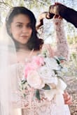 This dress was beyond beautiful in person. I purchased this dress to take our engagement pictures and I got compliments from strangers throughout the day. 

Perhaps it was just my dress, but we has issues with pulling up the zipper, as it kept getting stuck. Other than that, I would recommend this dress. - Melissa A.