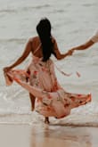 I wore this dress for my save-the-date photo shoot. We are having a tropical wedding so it was perfect for the shoot. I love the satin material and the design on it. The dress fit me perfectly. It also accentuates my chest, and I did not have to wear a bra with it! It is flowy and was not too long and I am 5'2"! It fit true to size for me! If you are looking for a nice flowy dress, this is perfect for photoshoots! - Mary C.