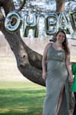 I wore this dress for our engagement / pregnancy announcement photos and it matches our wedding colors perfectly. Super comfy and cute with some wedges! Flowy but hits your curves in all the right places. Would pair well with a cute little denim jacket. I also bought the red one. - Katrina S.