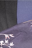 The color is closer to black than navy in natural light. Top fits a little looser than expected, which would be good for busty ladies. Length is long on my short height, which is expected. I'll be returning as I need a navy or dark blue color vs near-black. Posting a photo comparing with black and navy jackets in natural lighting vs low lighting with flash for reference. - Chelsea D.