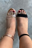 I am usually a 6, but have been a 5.5 in Lulus heels and flats. Ordered a 5.5 in rose gold and it fits perfect! I also own these Taylor heels in black suede. There is a huge difference in sizing. The rose gold glitter version is much more forgiving for wider feet! The toe area and strap are more roomy and don't crush the little toe. - Gabrielle D.
