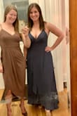 *I'm the blonde* After reading the reviews, I ordered a S and it fit perfect! The material is heavier and lays really nice (hid my tummy pooch well) and I absolutely LOVED the color! The height was great with 4" heels, it wouldn't need hemmed (I'm 5'4"). My only complaint is that the straps were already digging into my shoulders after 5 mins of wear. It fit my friend (who is the same height, with bigger boobs and butt) great too! Her only complaint is that her upper side torso area/side boob area felt too exposed because the straps were looser to accommodate her boobs (I'm between a B and C and she's bigger haha). - Meg S.