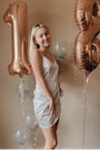 The dress is a little loose on me but otherwise perfect! Really nice material, feels expensive and beautiful. Made my eighteenth bday pics look great:) - Bekah W.