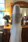 No one would have ever guessed this dress was $88! It's hard to see in the pics but we added a belt detailing (which we got online for less than $20) and had it fitted to me and it was perfect! I borrowed my sister's veil and it was the perfect ensemble. If you are looking for something that can be personalized to you, comfy and easy, and great quality for a lower price I would highly recommend!! My hips are wider so i went with an XL! We had to do a lot of taking in in the bust/waist and just a tad in the hips, but I think a large would have been way too form fitting for the look I was going for! Fitting, dress, and belt detailing still cost less than $200 total. - Kristen T.