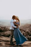This dress is beautiful but it's very long and the cleavage is cut ridiculously low. I tried to wear sticky boobs for my engagement pictures and had to take them out because you could see them. The slit is awkwardly positioned. - Lacey G.