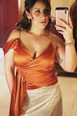 I originally ordered a different color in a Large and felt like my busts were going to bust out, ordered this color in XL and was allot more comfortable. Love it, got so many compliments on it. - Johana R.